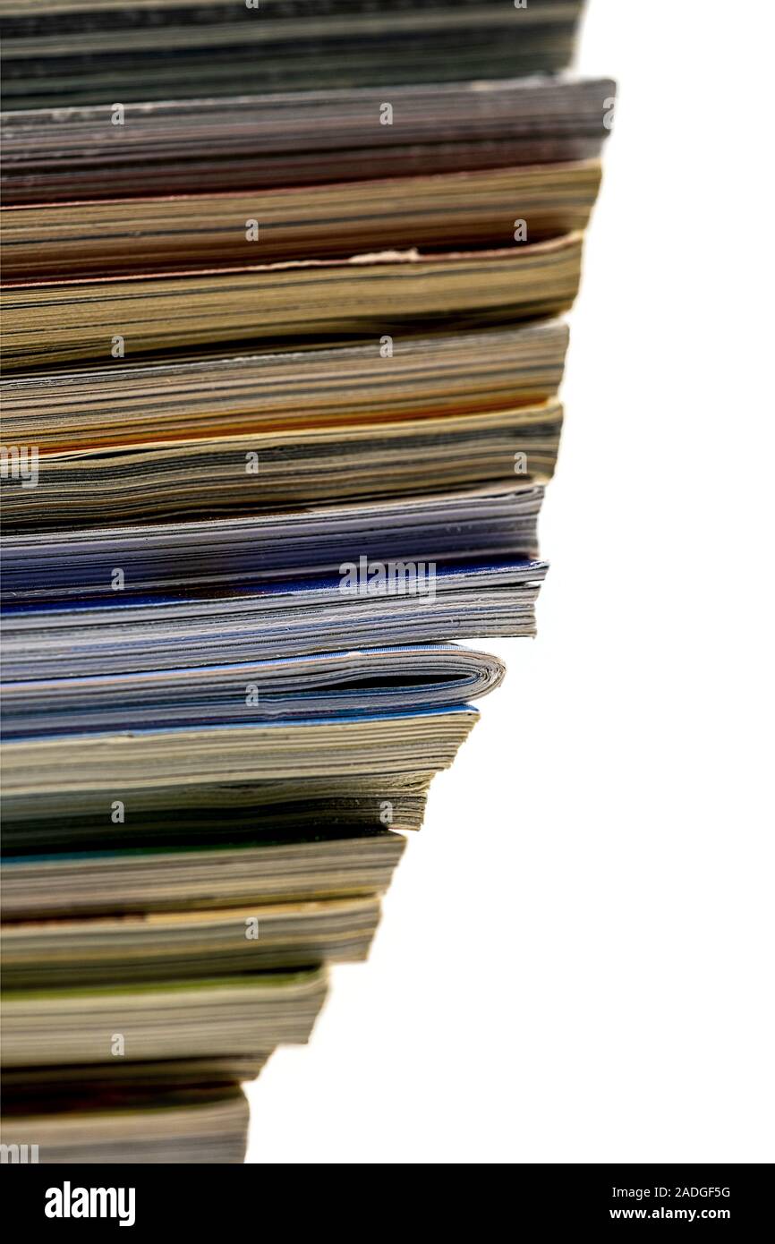stacked magazines one in in the opposite direction Stock Photo
