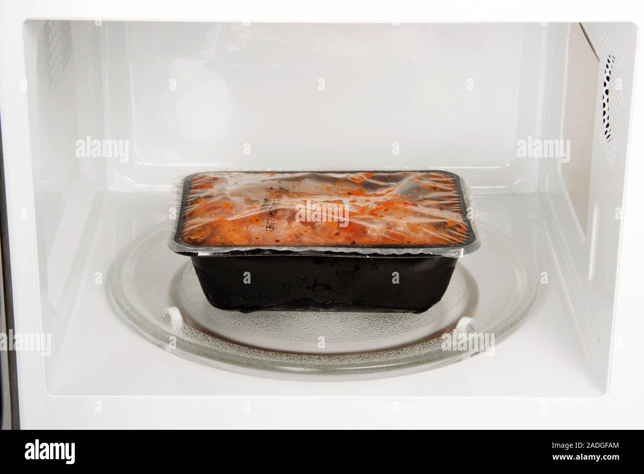 Microwave cooking. Cooked 'ready meal' inside a microwave oven