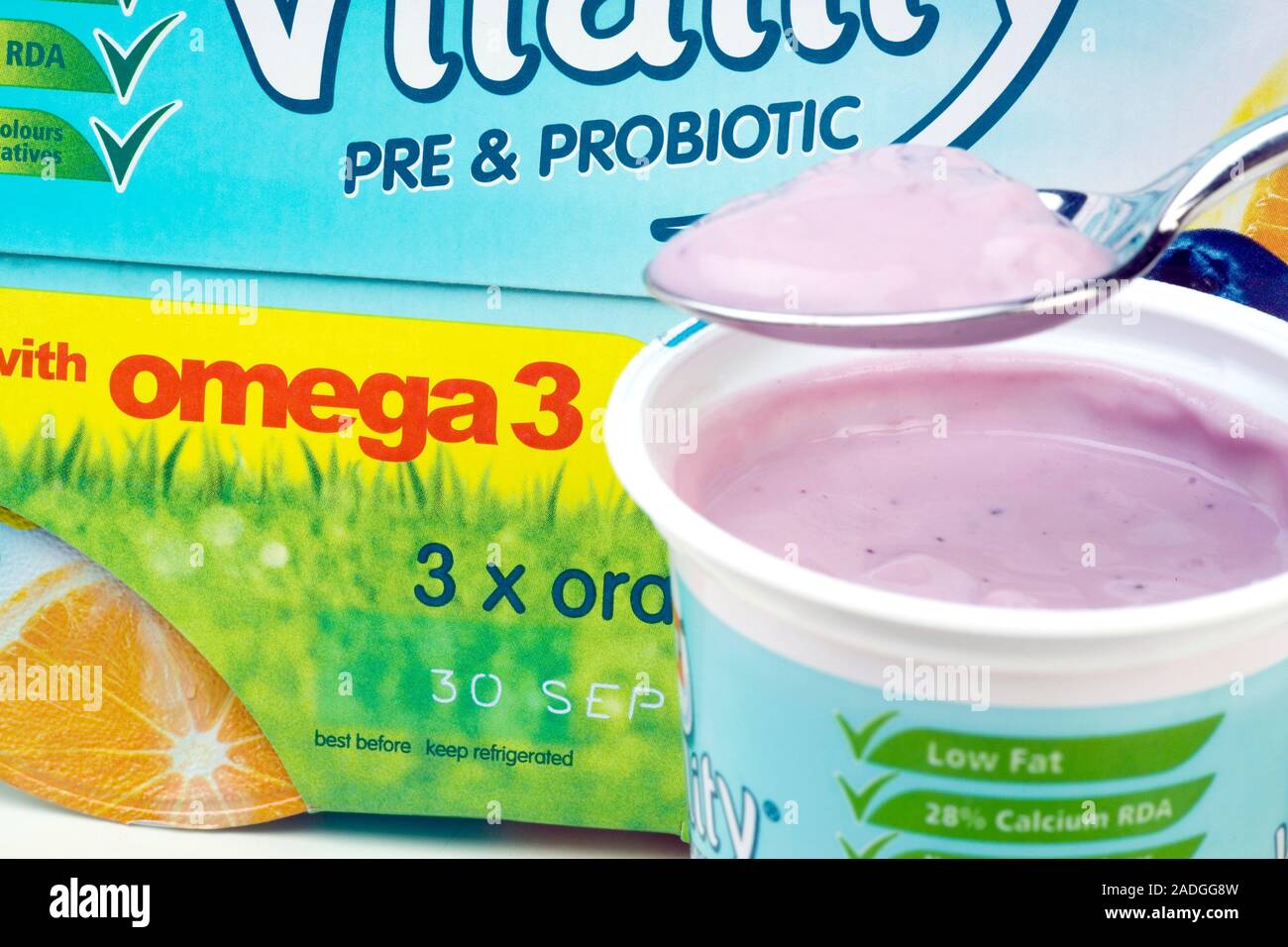 Prebiotic and probiotic yoghurt drink with a spoon. This yoghurt drink