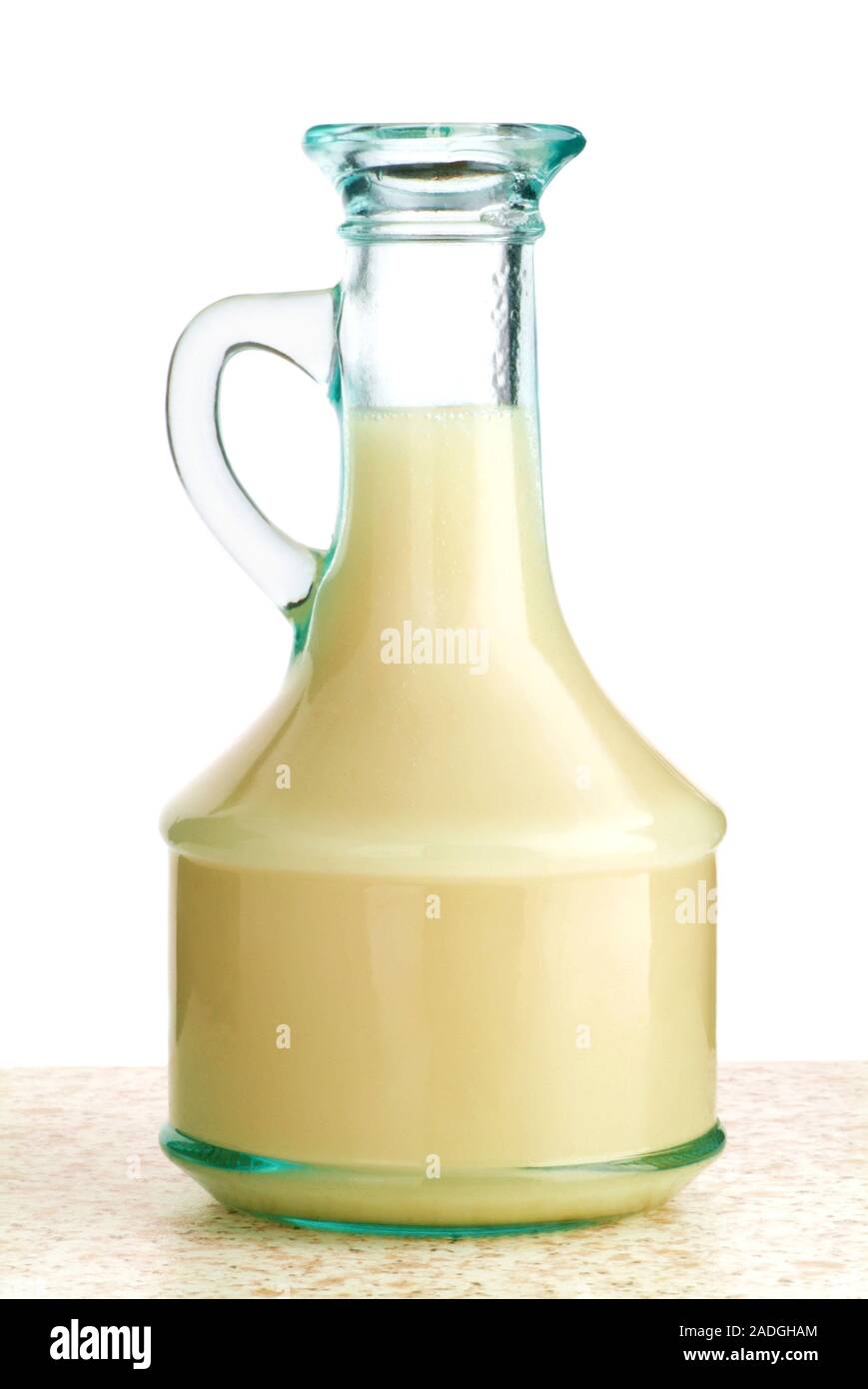 Oil and vinegar salad dressing. Emulsion of oil and vinegar in a jar