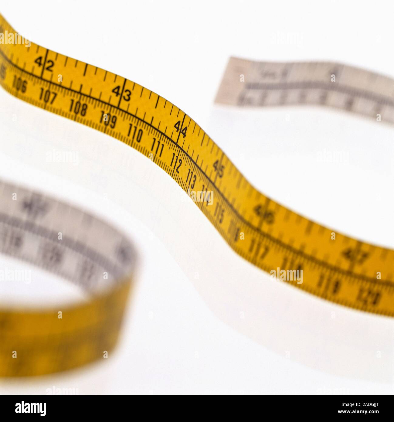 Tape measure marked with inches and centimetres Stock Photo Alamy