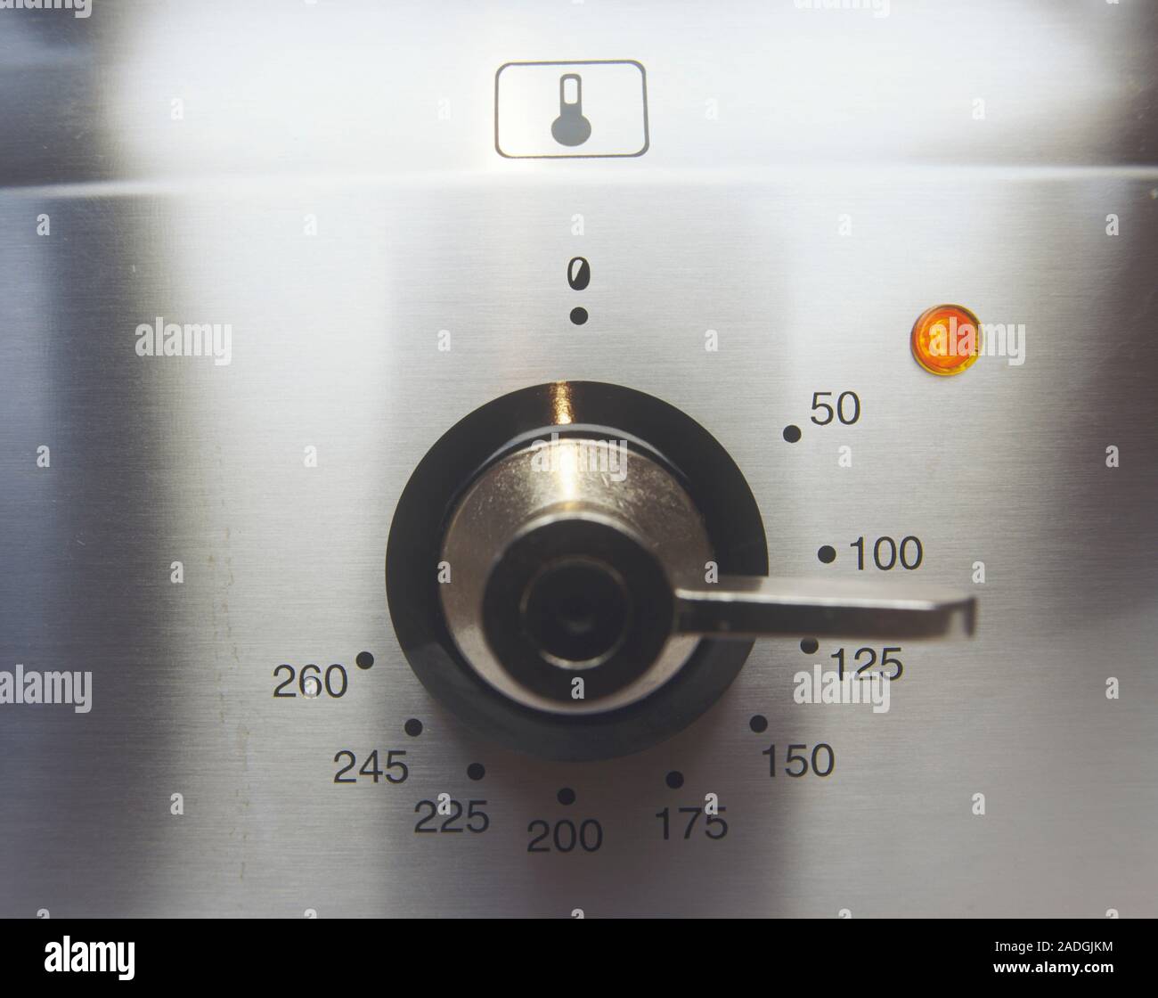 Electric oven temperature dial. The dial ranges from 0-260 degrees ...