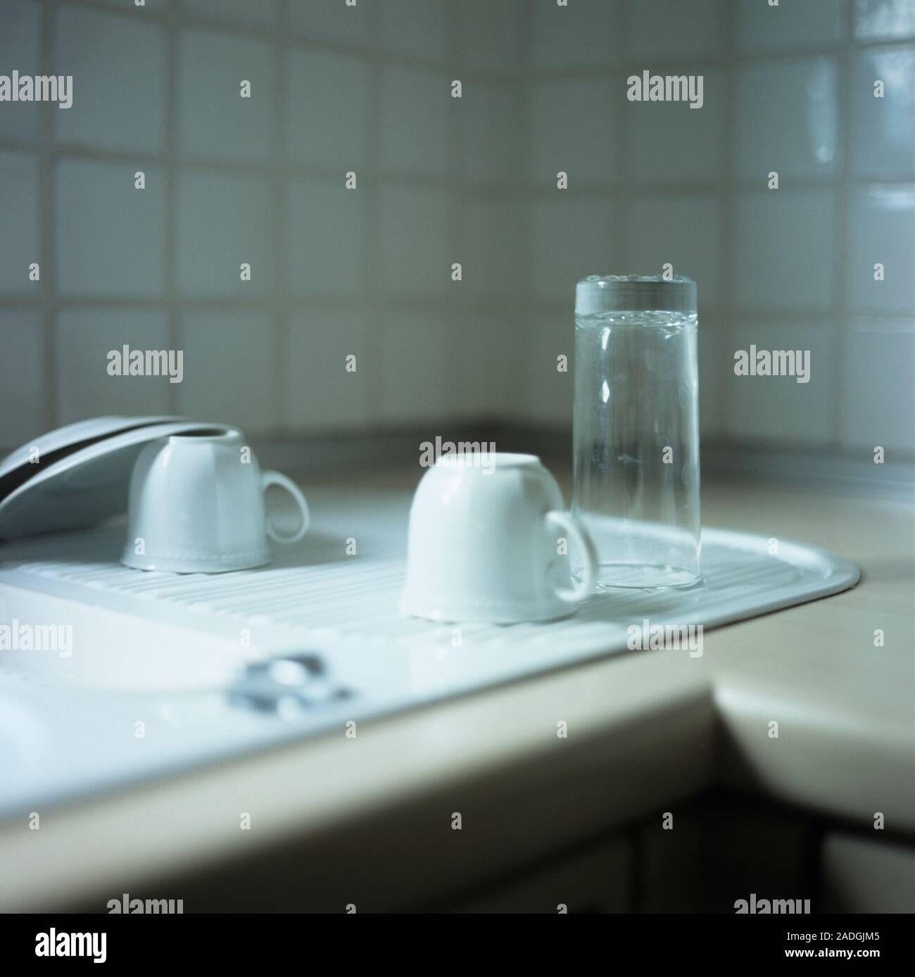 Crockery on a draining board Stock Photo Alamy