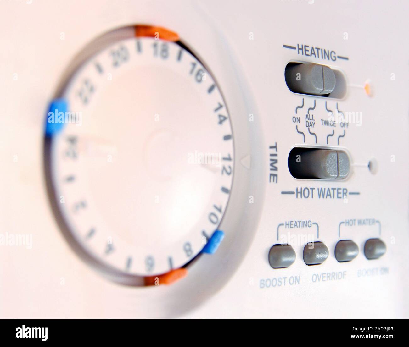 Central heating control panel with a timer dial on the left Stock Photo