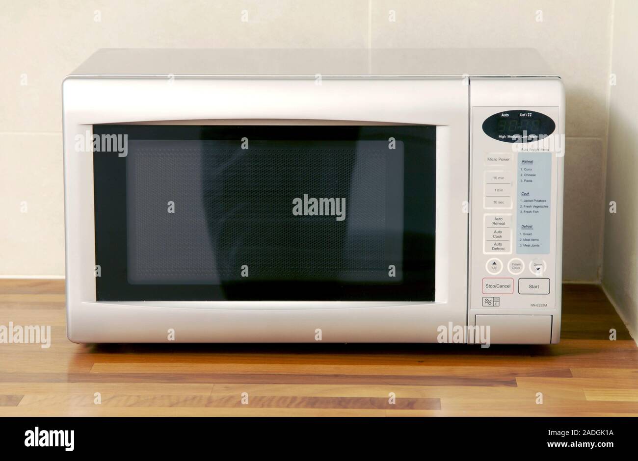Domestic microwave oven in a kitchen. Microwave ovens cook food using
