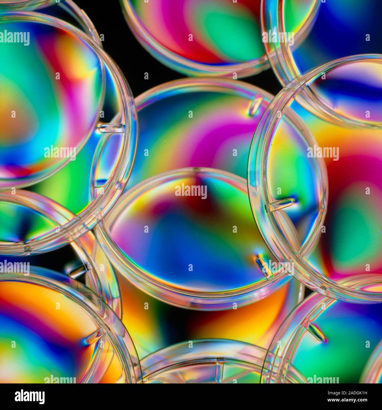 Coloured light interference patterns on an assortment of plastic ...