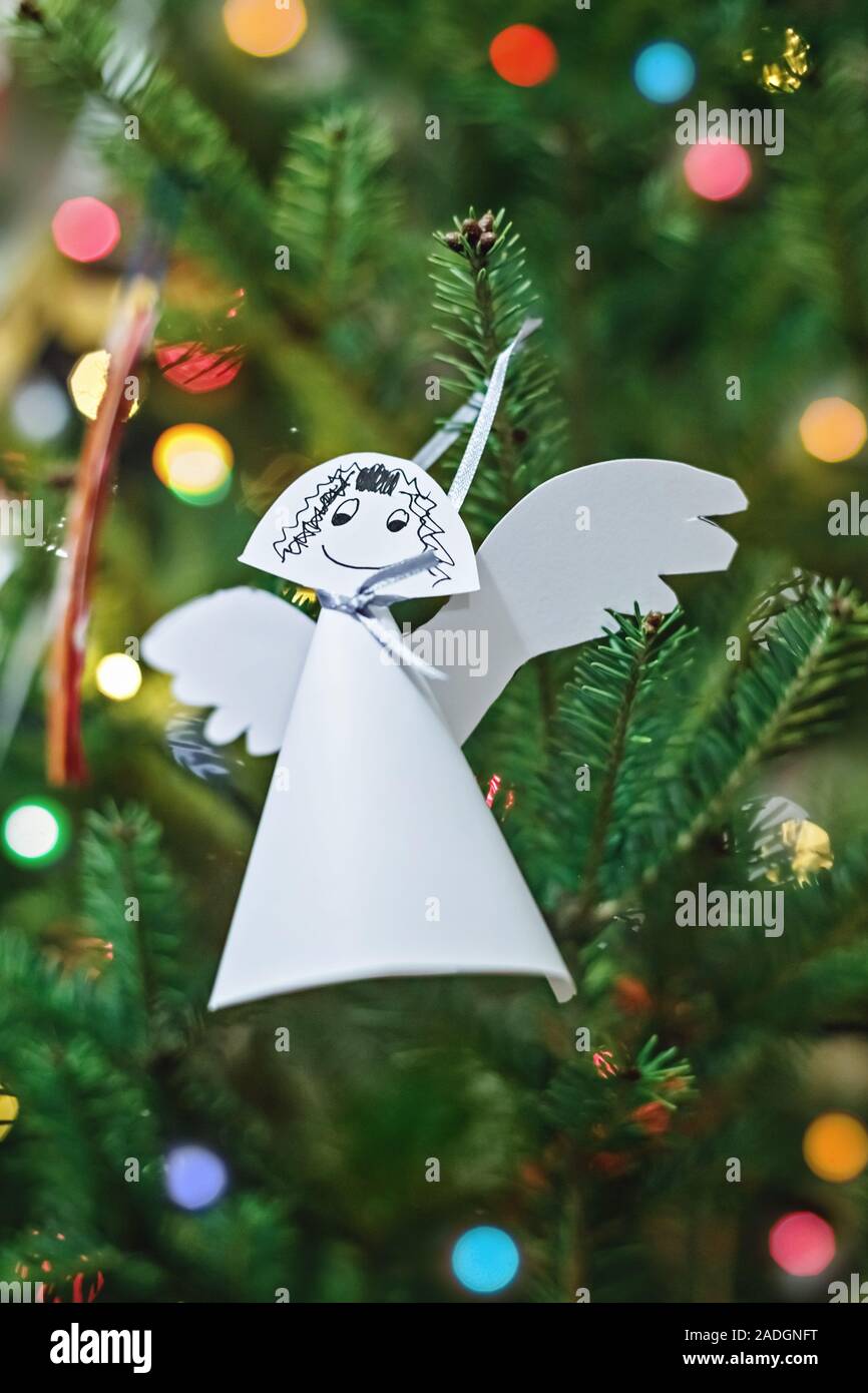 Angel made of white paper, hanging on Christmas tree. Easy DIY Stock Photo  - Alamy