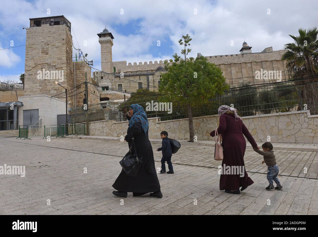 Palestinians walk near The Tomb of the Patriarchs, or the Ibrahimi Mosque, in the divided city of Hebron, West Bank, on Wednesday, December 4, 2019. Israeli Defense Minister Naftali Bennett ordered officials to start planning a new Jewish settlement in the heart of Hebron, which Palestinian officials say is a result of U.S. President Donald Trump's decision to legitimize settlements.  Photo by Debbie Hill/UPI Stock Photo