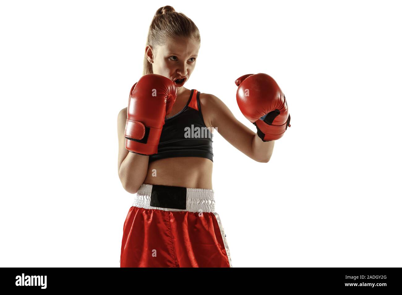 Young female kickboxing fighter training isolated on white background.  Caucasian blonde girl in red sportswear practicing in martial arts. Concept  of sport, healthy lifestyle, motion, action, youth Stock Photo - Alamy