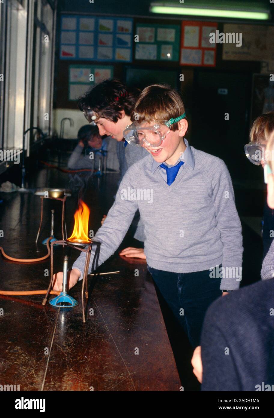 Pupils heating iron filing in practical chemistry class. Stock Photo