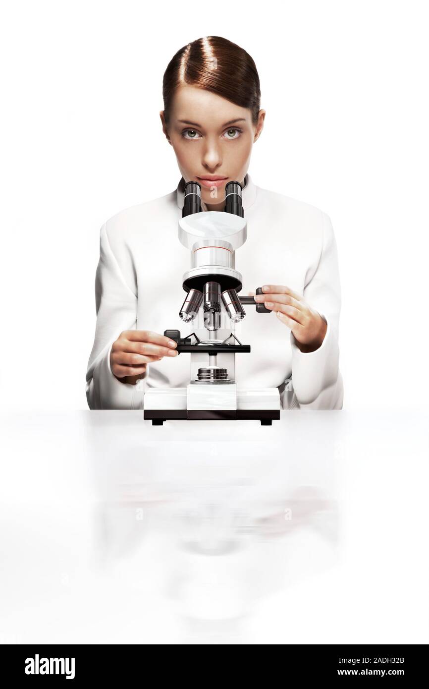 Light microscopy. Female researcher using a light microsope Stock Photo