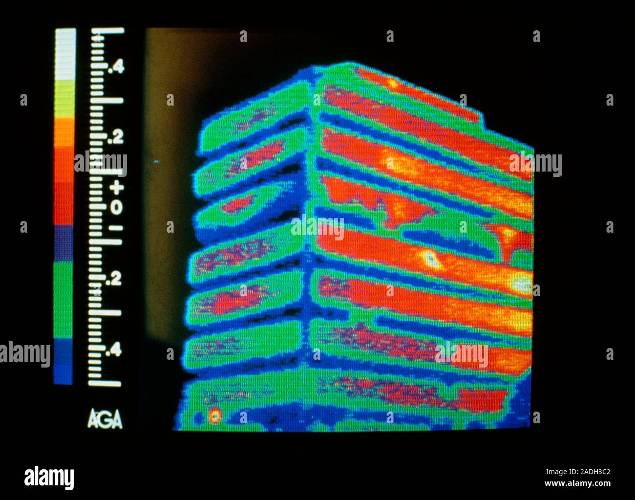 Thermogram of a multi-storey office building, showing heat loss. The ...
