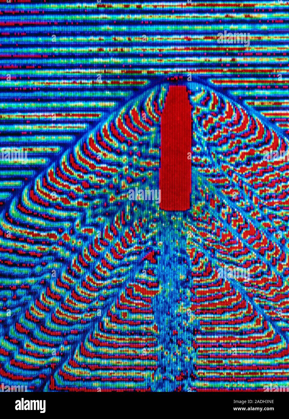 False-colour, high-speed image showing the air flow around a 20mm calibre bullet flying at 500 metres per second (m/s). The projectile's flight was re Stock Photo