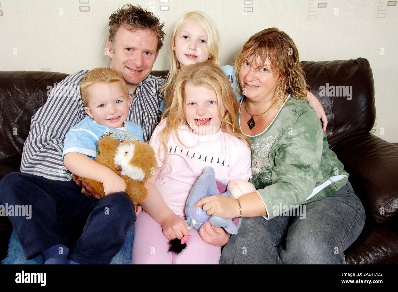 MODEL RELEASED. Angelman syndrome. 10yearold girl (lower centre) with