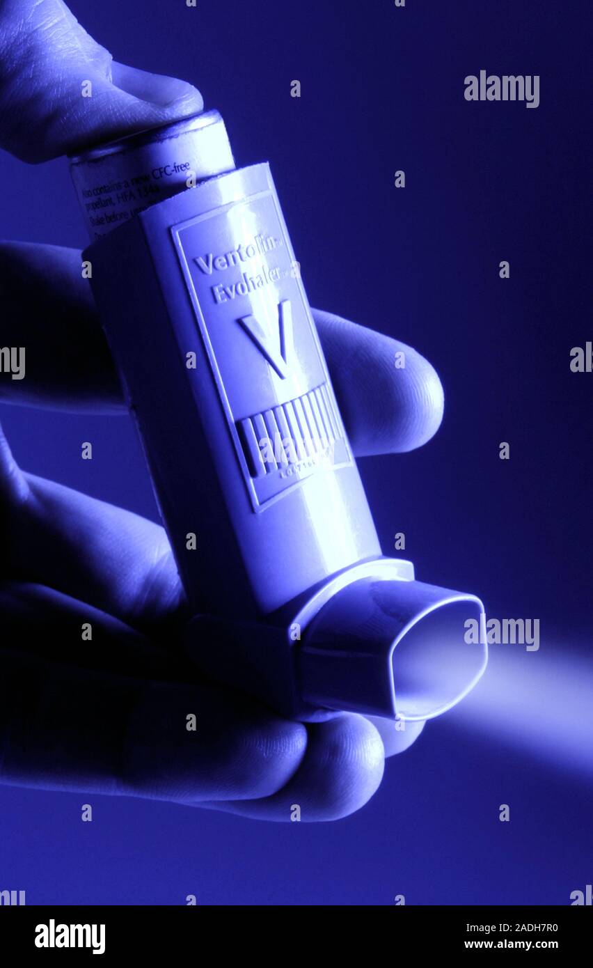 MODEL RELEASED. Asthma inhaler. Spray of the bronchodilator drug ventolin from an asthma inhaler