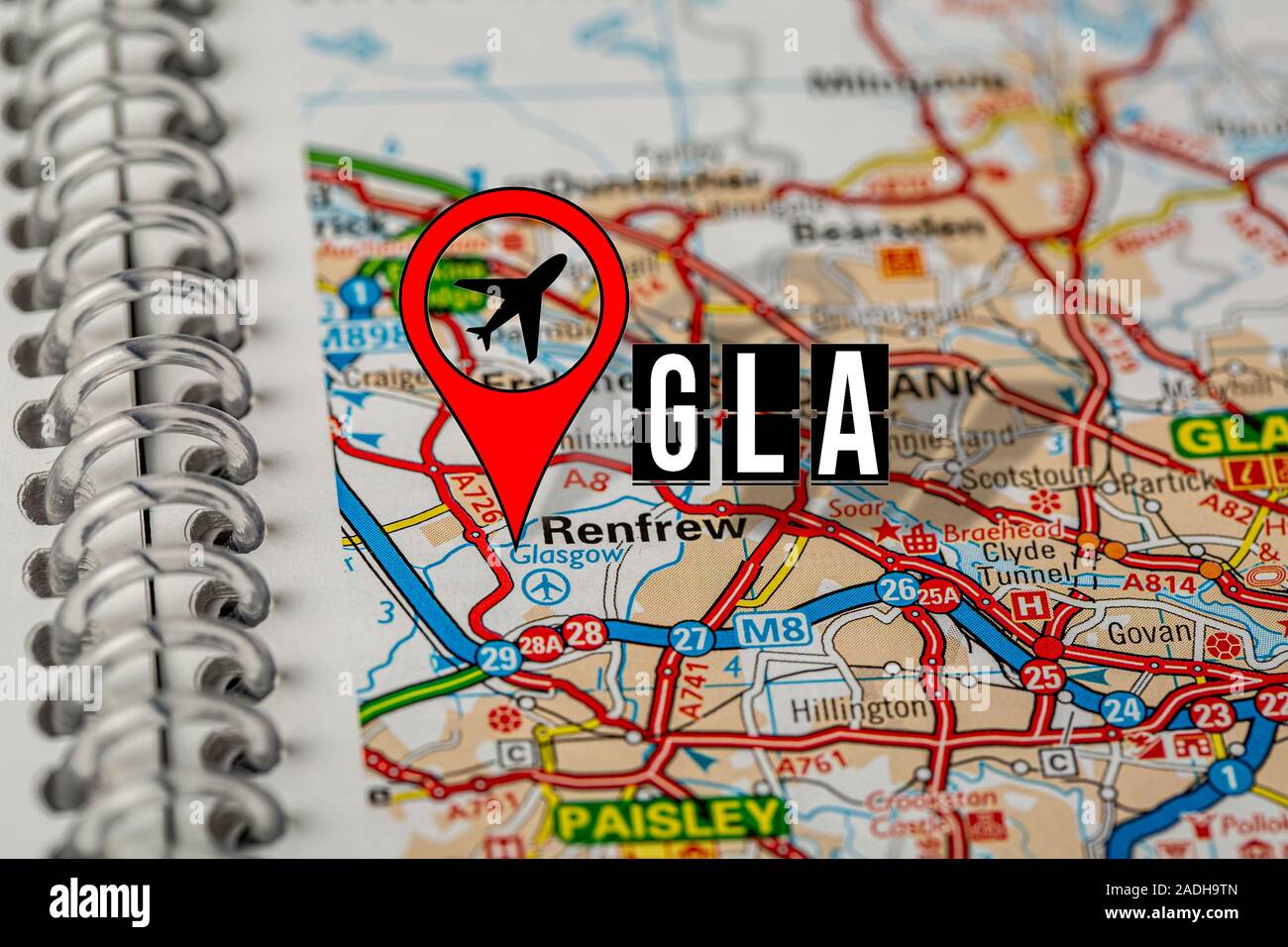 Red Pin on Paper Map Showing Position of Heathrow Airport Stock Photo