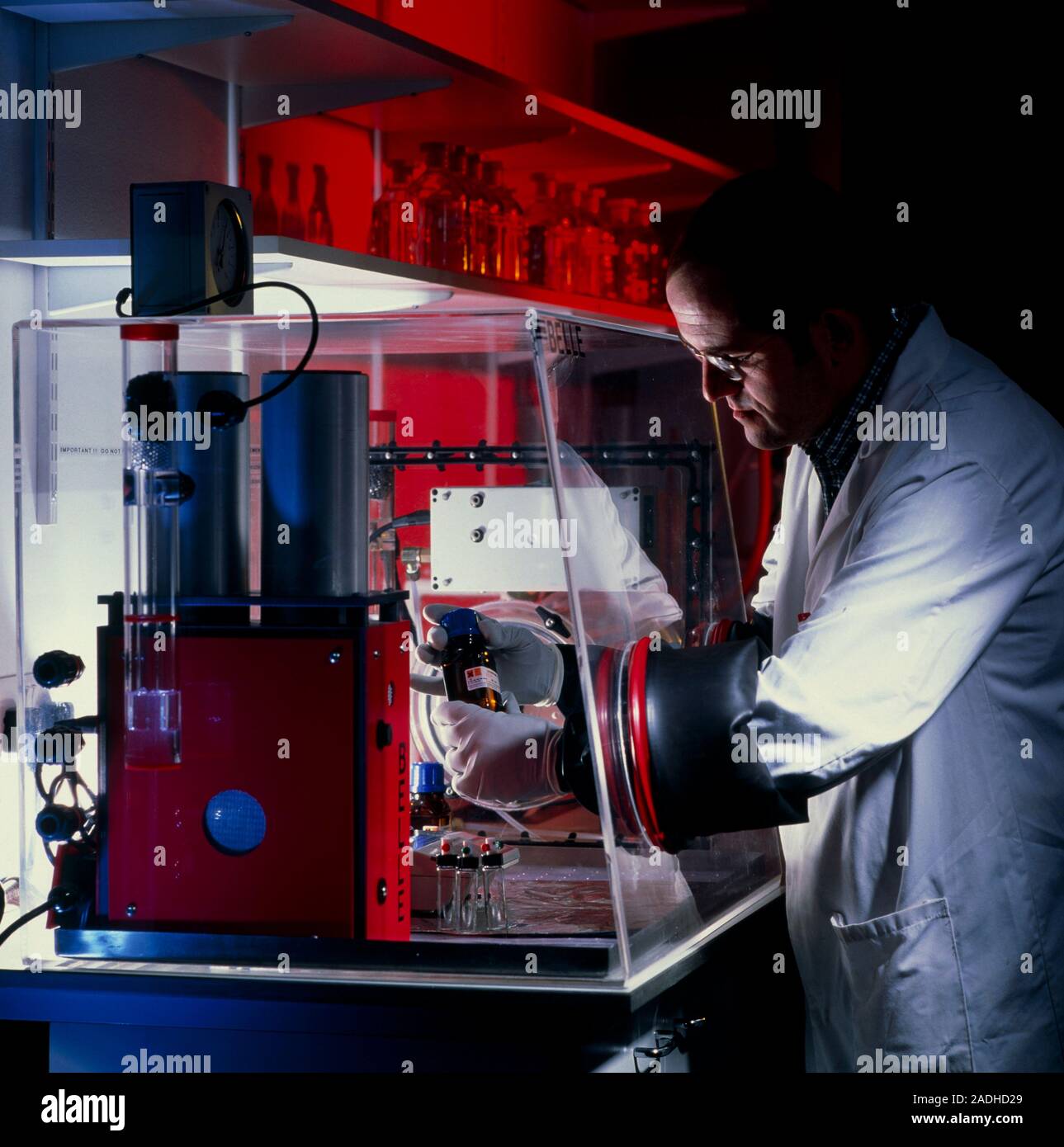 Kemo Box Method Glovebox use. Researcher using a glovebox during anticancer ...