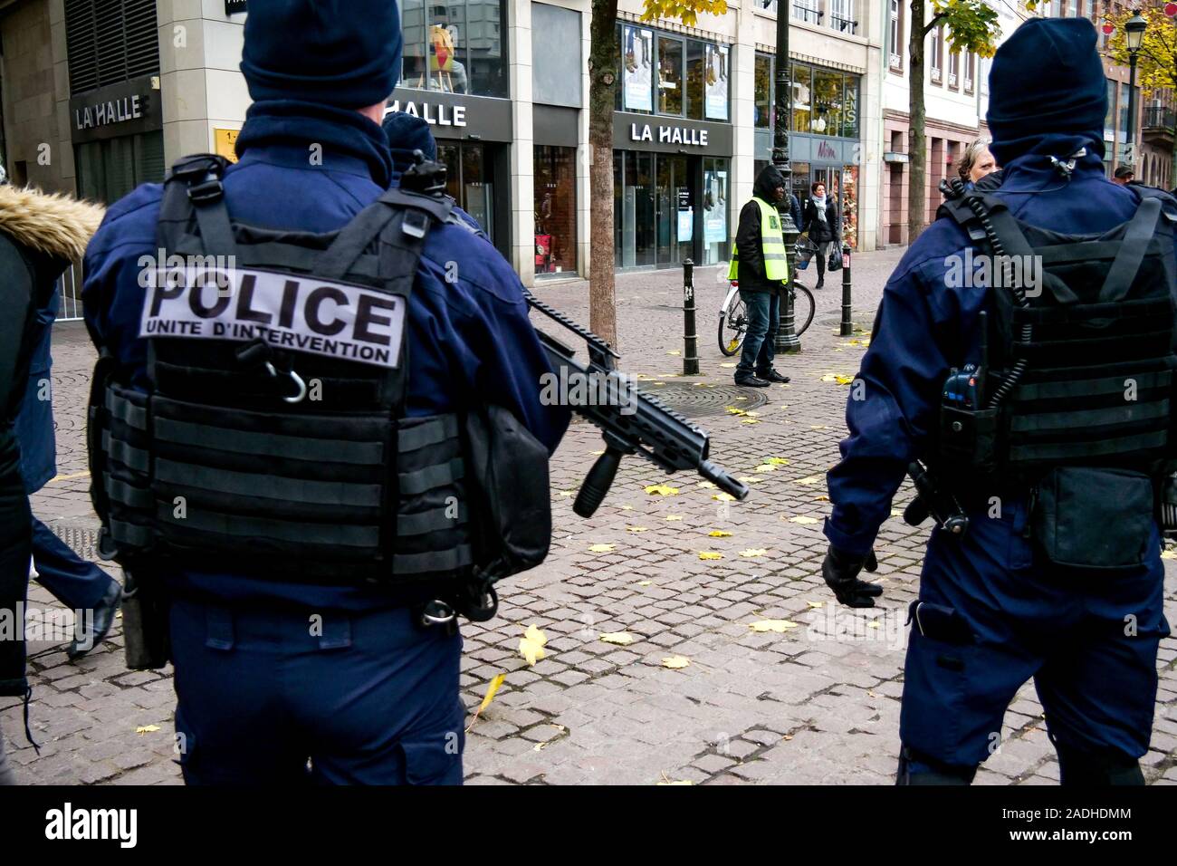 Heavily armed police officers patrol in Strasbourg, Bas-Rhin, Alsace, France Stock Photo
