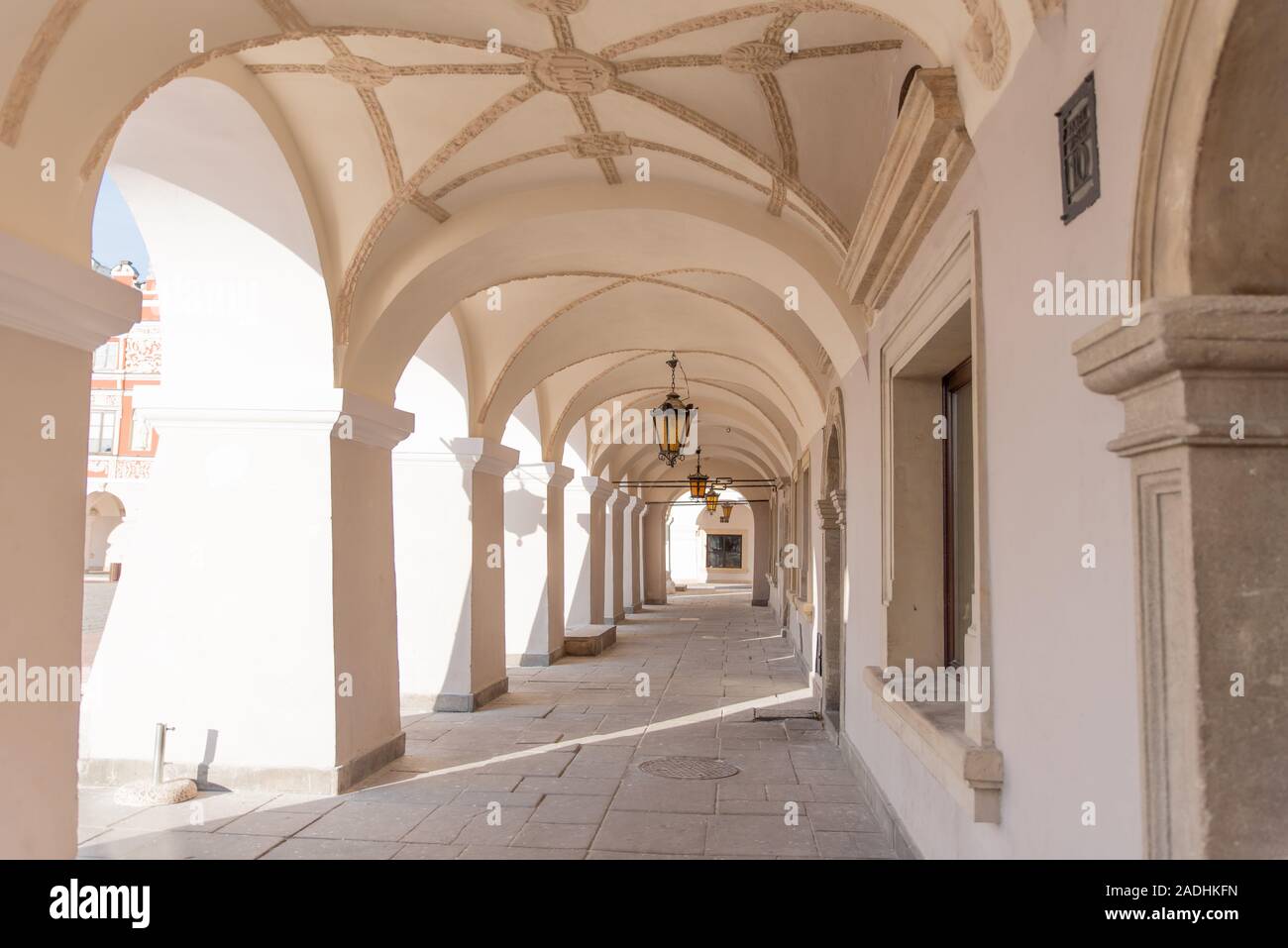 Old renaissance or mannerist arcades of tenement house in Zamosc Poland ...