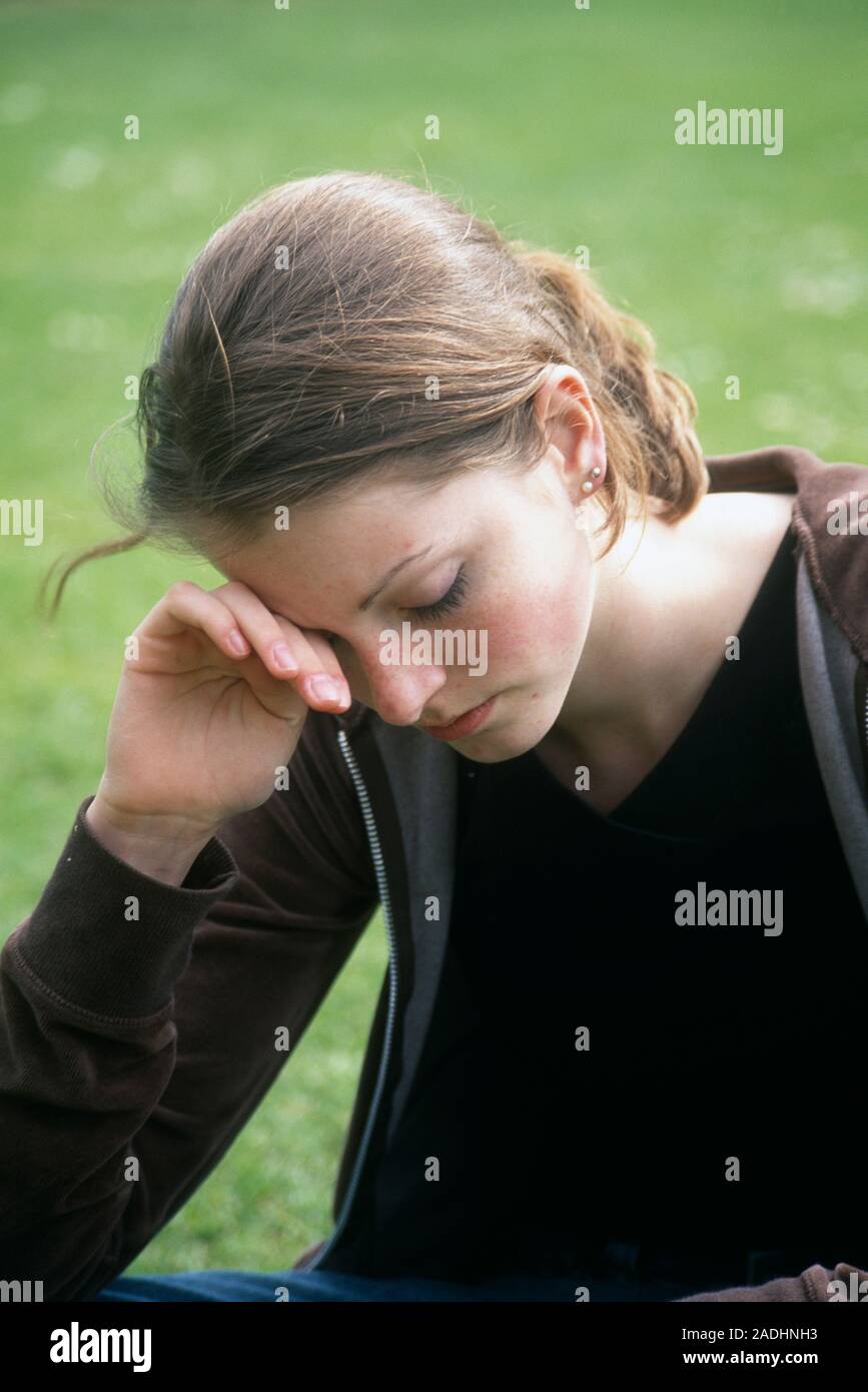 Sad teenager. Sad teenage girl resting her head on her hand Stock Photo ...