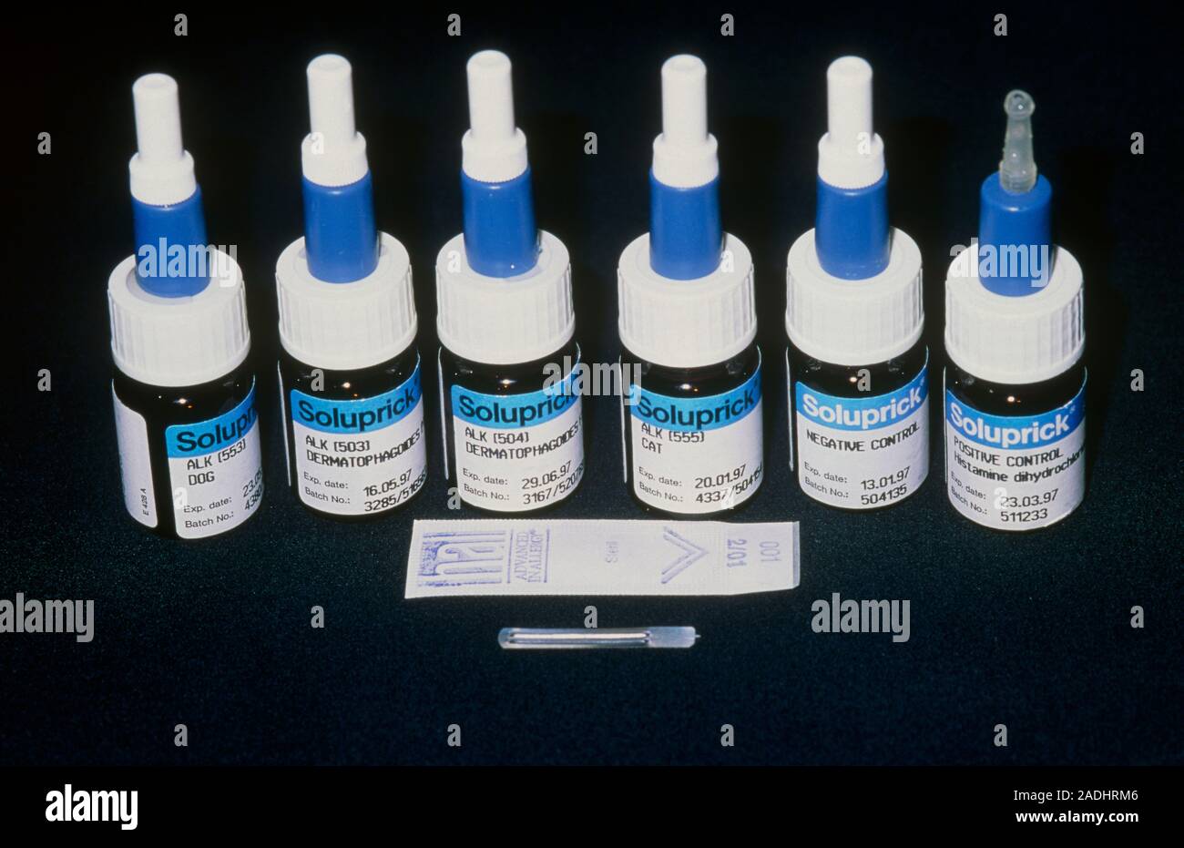 Allergy testing kit. Dropper bottles of allergens and sterile needles used in skin prick tests