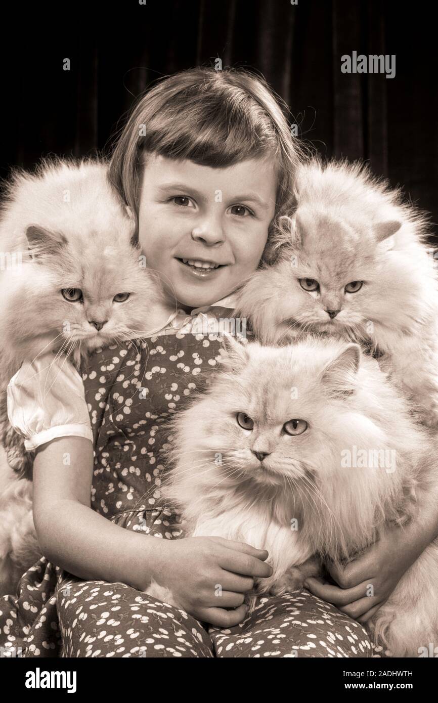 1950s SMILING GIRL LOOKING AT CAMERA SURROUNDED BY THREE GRUMPY SILVER ...