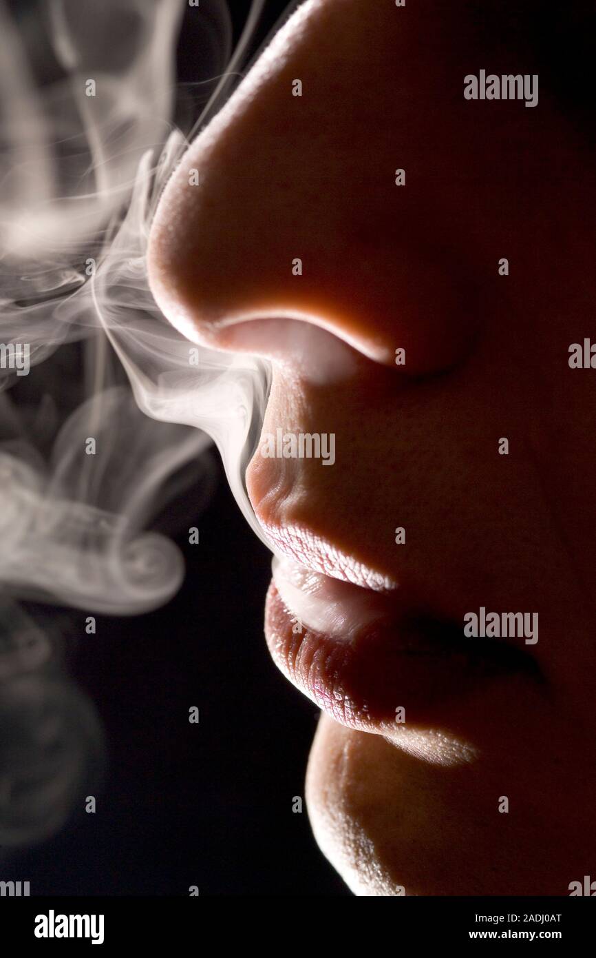 Man smoking. Cigarettes contain the addictive drug nicotine and cancer