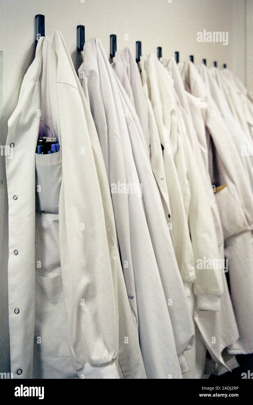 Laboratory coats. White lab coats hanging on hooks Stock Photo Alamy