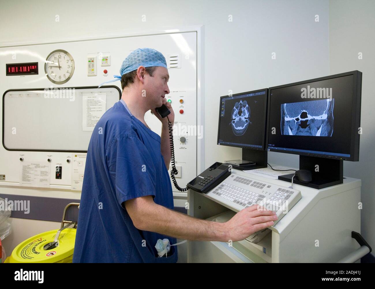 Radiologist studying computed tomography (CT) scans of the head of a