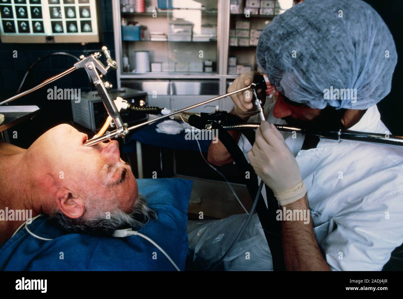 Doctor using a bronchoscope to examine the trachea (windpipe) and
