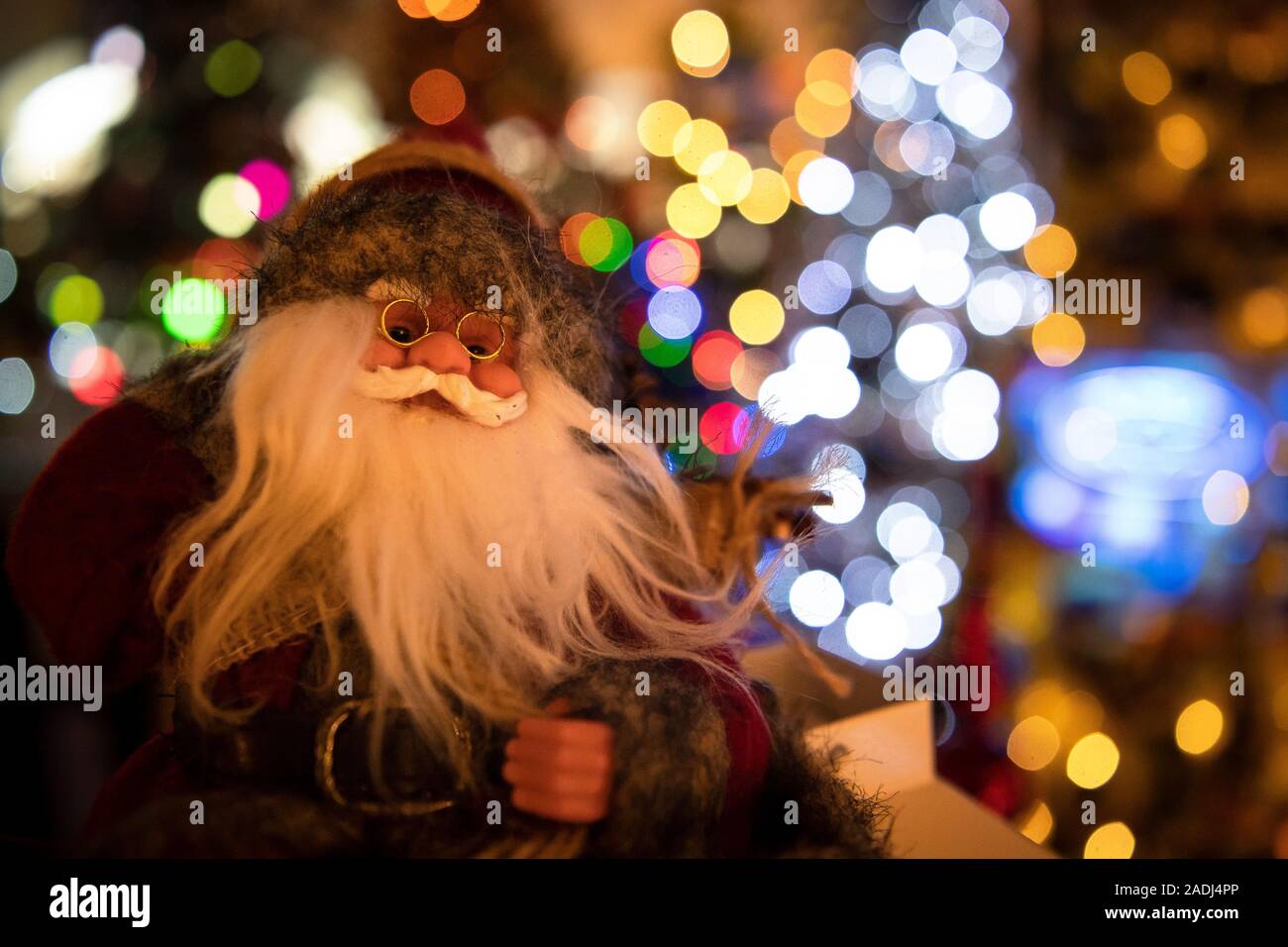 Rinteln, Germany. 04th Dec, 2019. There's a Santa figure standing in the Jeromin family house. There are many Christmas houses in Germany that are illuminated from the outside. Thomas Jeromin, on the other hand, has created a Christmas wonderland in his living rooms. His collection of self-decorated plastic trees is even recognized as a world record. Credit: Sina Schuldt/dpa/Alamy Live News Stock Photo