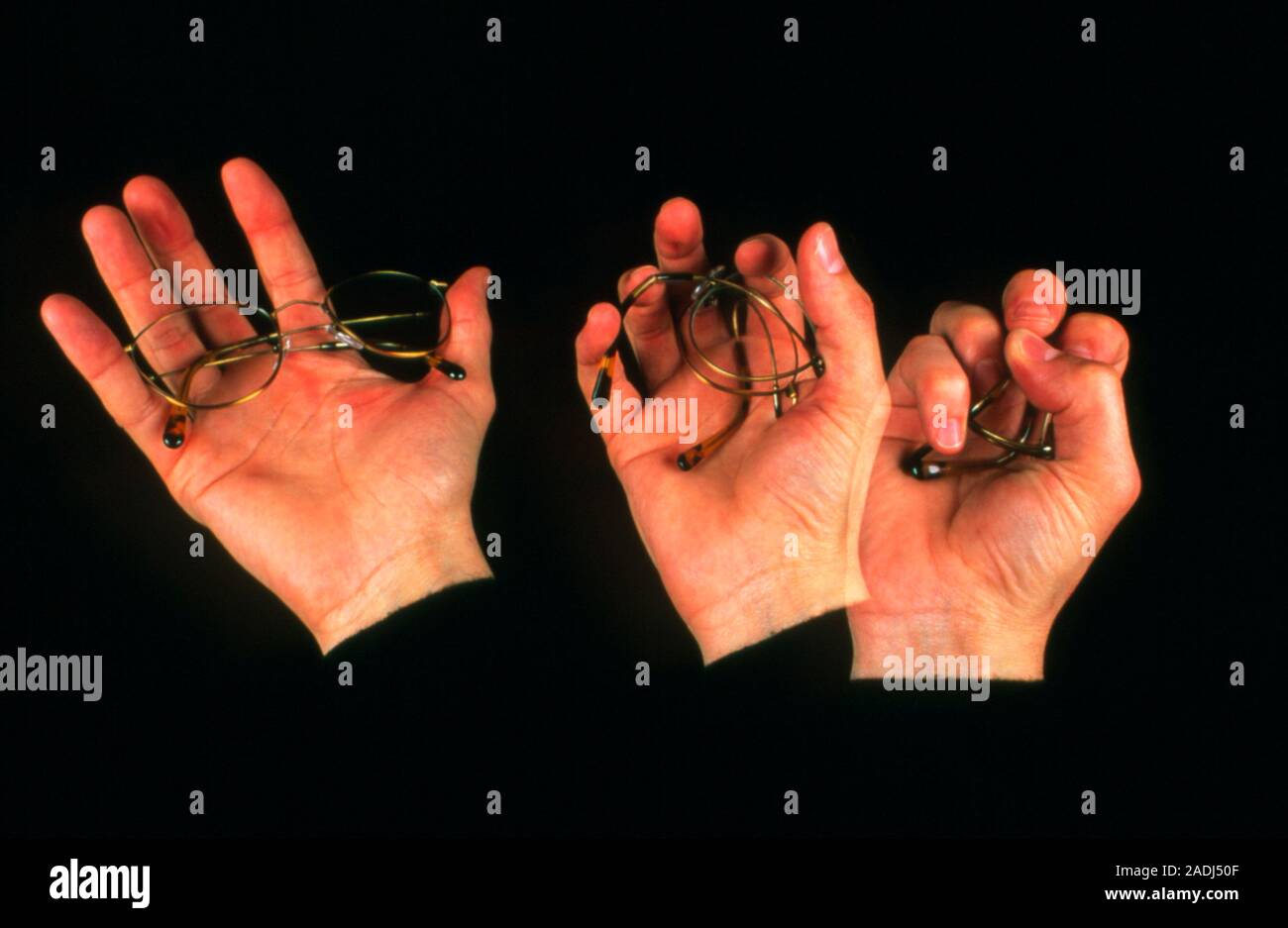 Memory metal glasses. Timelapse image of a hand crushing spectacles