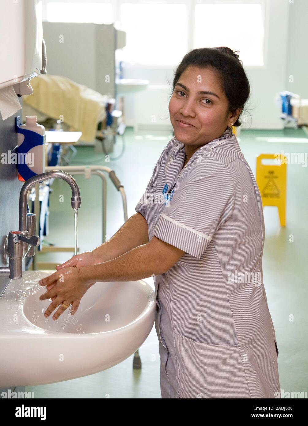 MODEL RELEASED. Hospital hygiene. Nurse washing her hands. Cleanliness