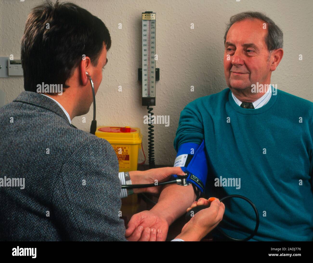 Blood pressure measurement. A general practice doctor monitors blood