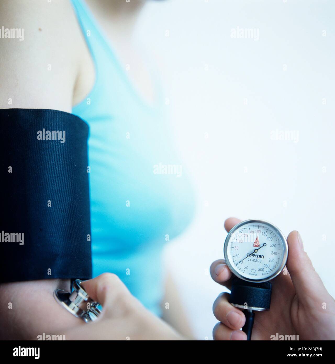 Blood pressure measurement. Doctor holding a stethoscope bell (lower