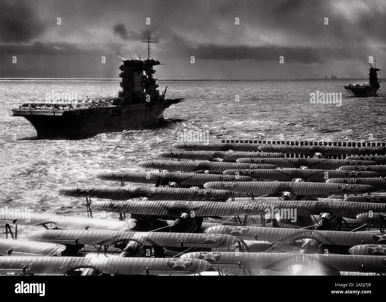 1930s USN PACIFIC FLEET AIRCRAFT CARRIERS SARATOGA AND LEXINGTON SEEN FROM FLIGHT DECK OF CARRIER RANGER BEFORE WORLD WAR II  - n143 HAR001 HARS CARRIERS USN FLIGHT DECK PACIFIC OCEAN SARATOGA SEEN BIPLANES BLACK AND WHITE HAR001 OLD FASHIONED RANGER Stock Photo
