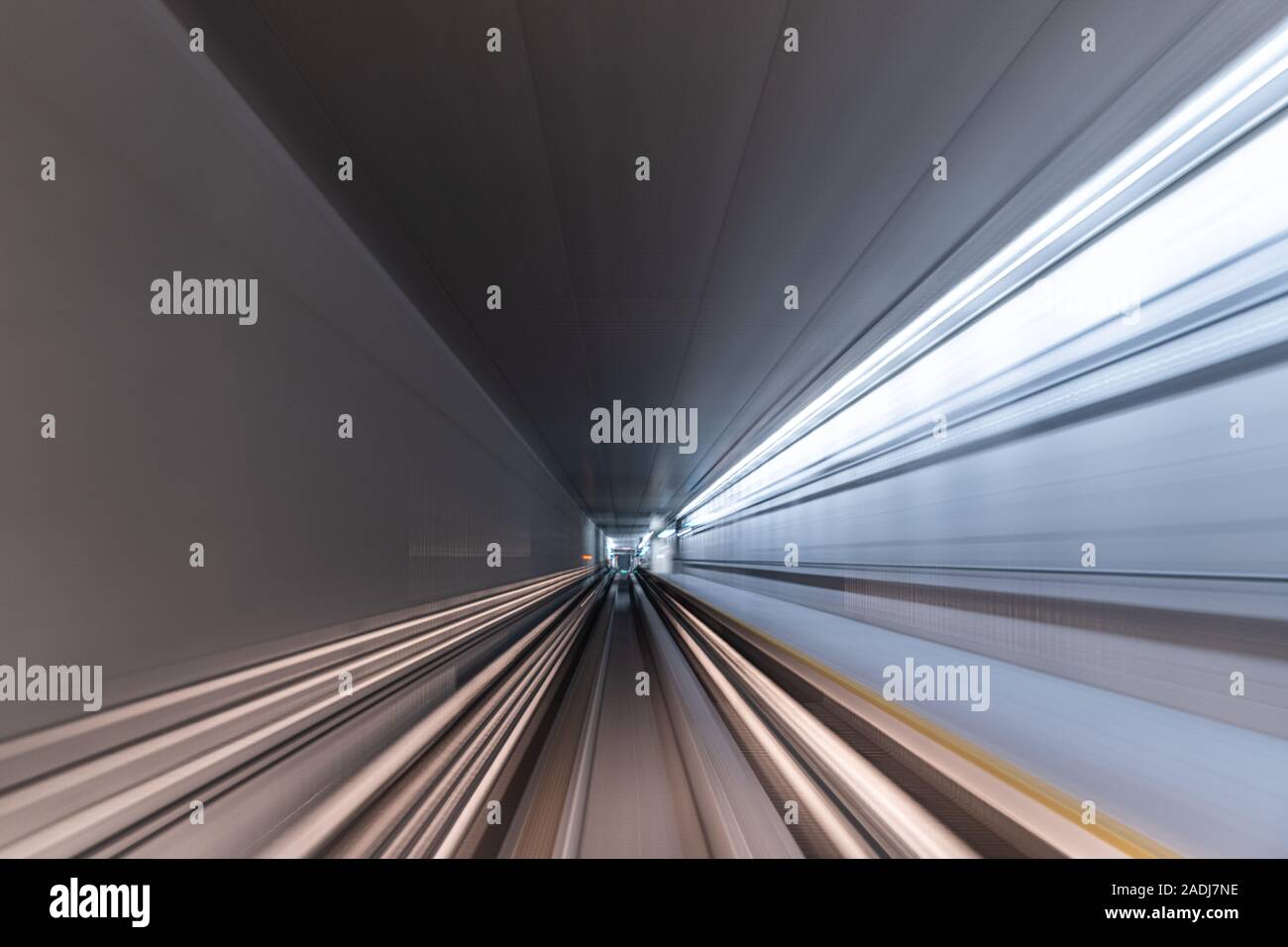 Blurred Motion Travel in train on tunnel Stock Photo