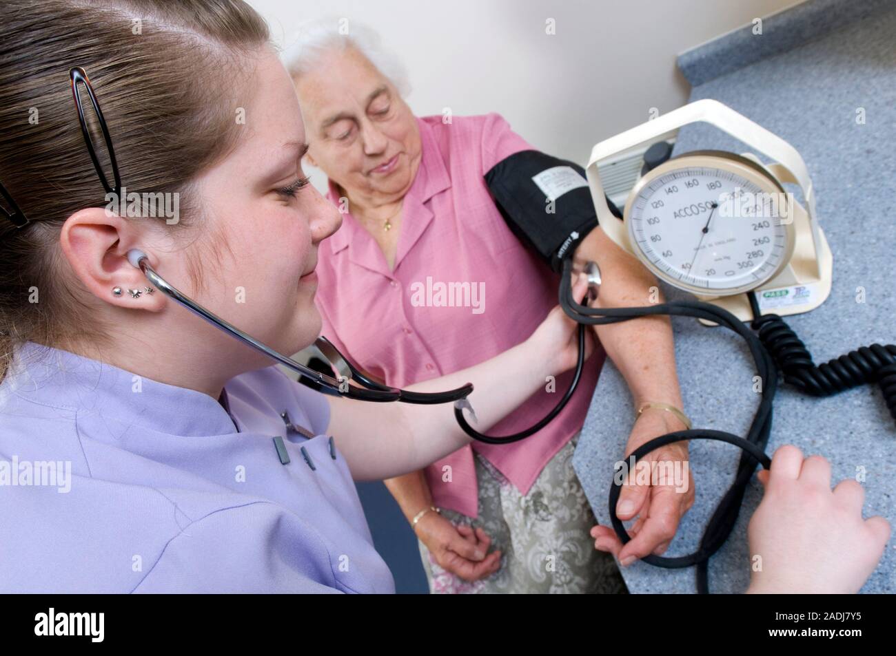 Measuring blood pressure. Elderly patient having her blood pressure
