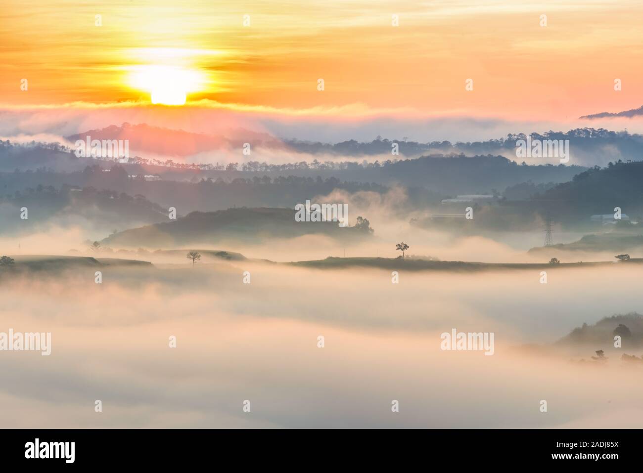 Foggy mountain range landscape at beautiful sunrise morning Stock Photo ...