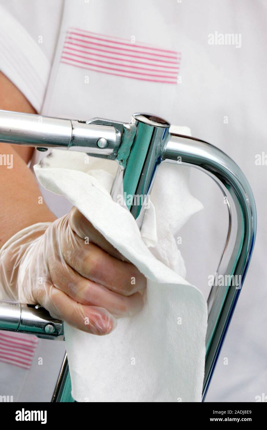 Cleaning hospital bed. Rail of a hospital bed being cleaned and