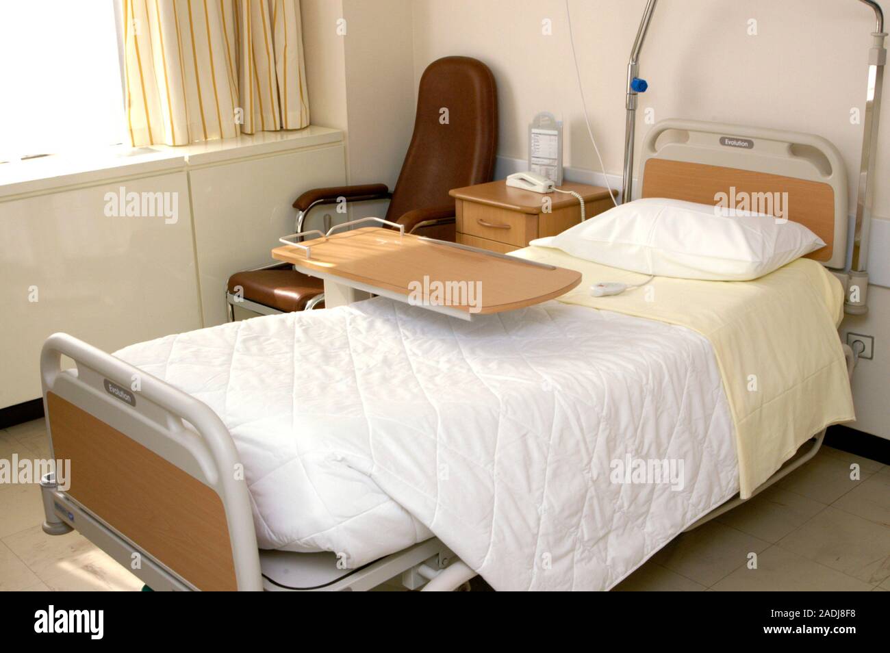 Clean hospital room. Hospital bed and furniture in a room that has been
