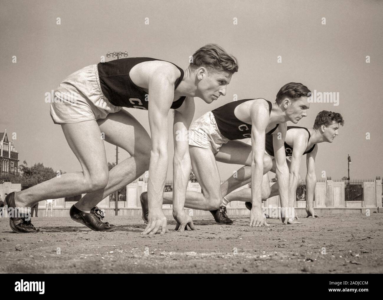 1940s Three Runners At Starting Line Of Foot Race Track And Field S3474 Har001 Hars Inspiration Males Athletic Confidence B W Goals Strength Strategy Universities And Excitement Low Angle Recreation Pride Opportunity