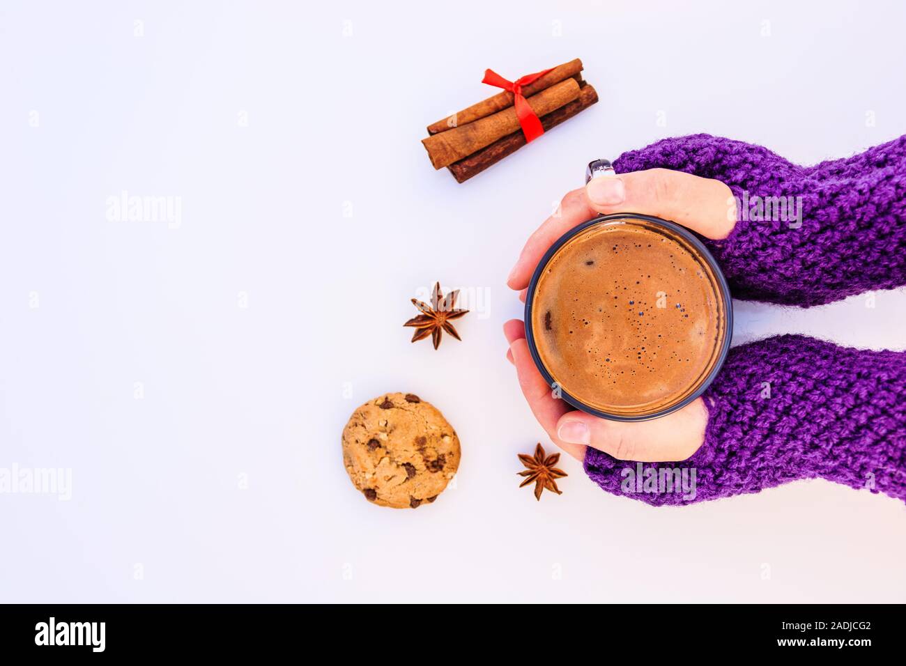 Female hands holding hot chocolate  on a white background. Stock Photo