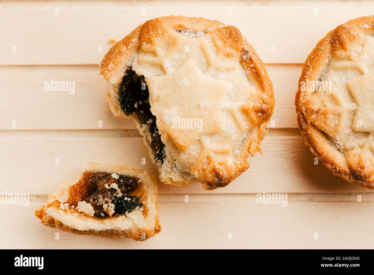 Top view of traditional British Christmas pies on wooden board Stock Photo
