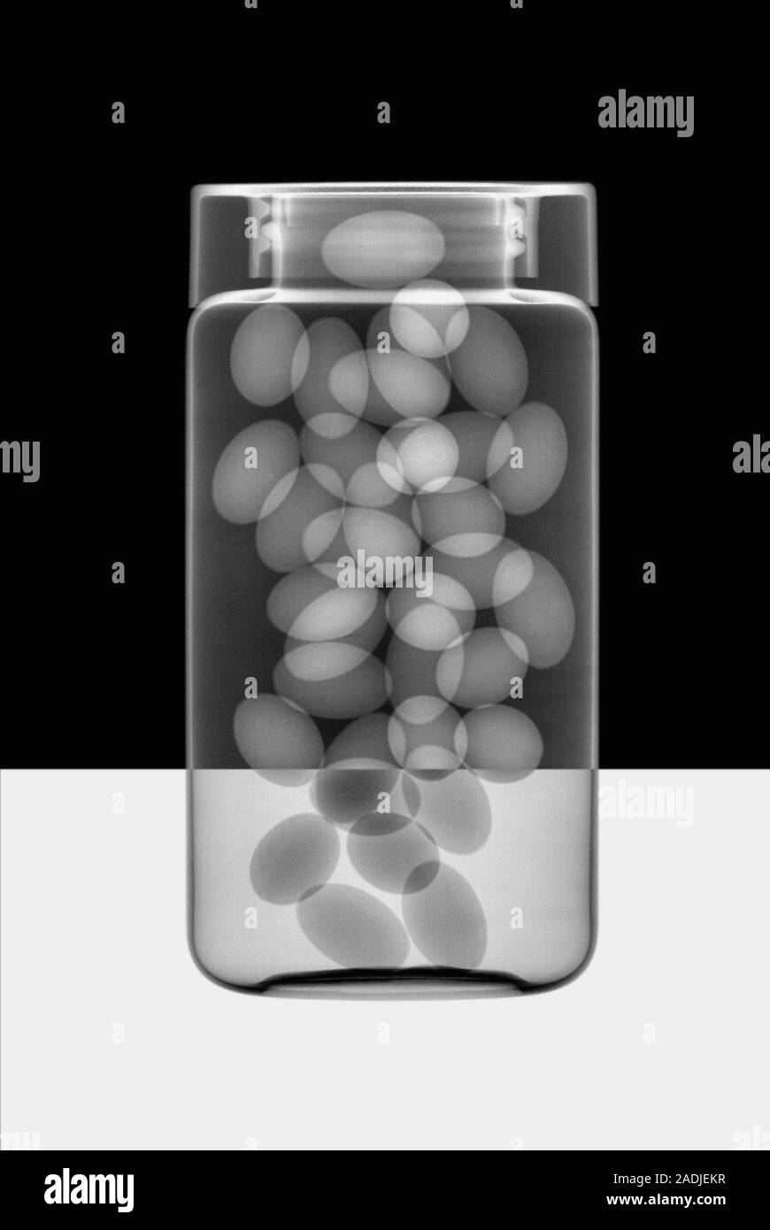 Oil capsules in a bottle, Xray Stock Photo Alamy