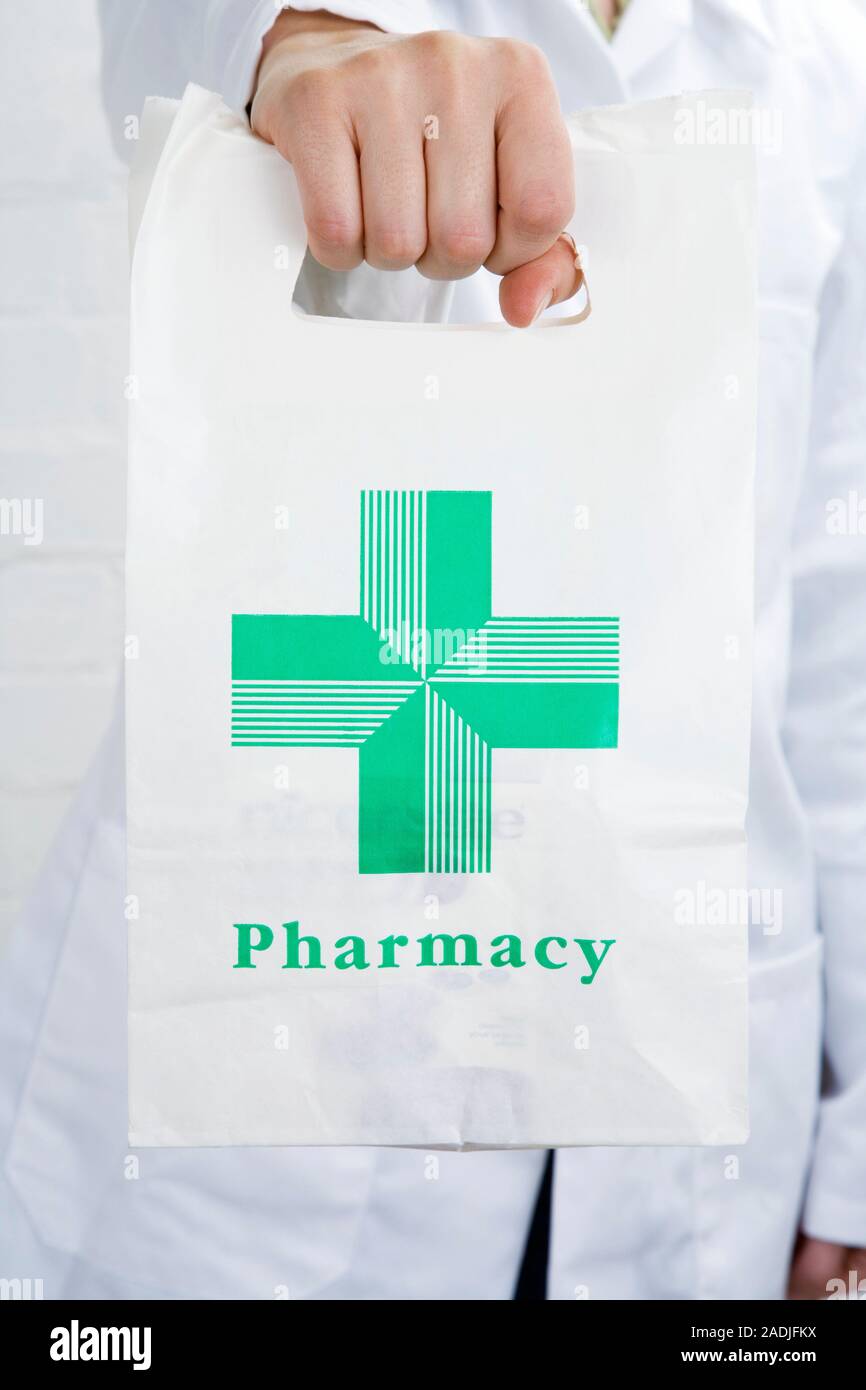 Pharmacist carrying a pharmacy bag Stock Photo Alamy