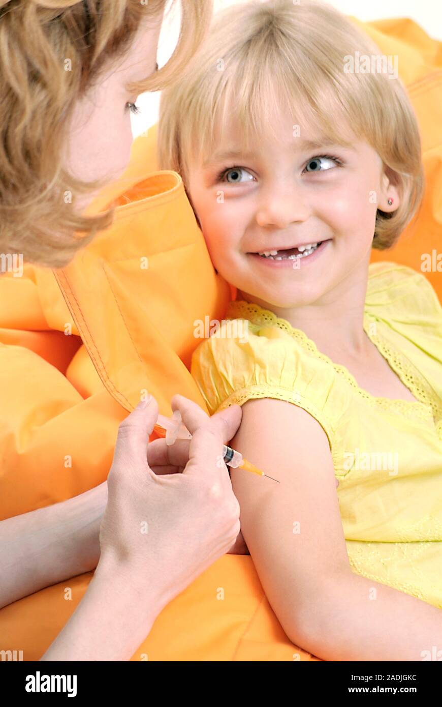 Childhood vaccination. Girl receiving an injection Stock Photo Alamy