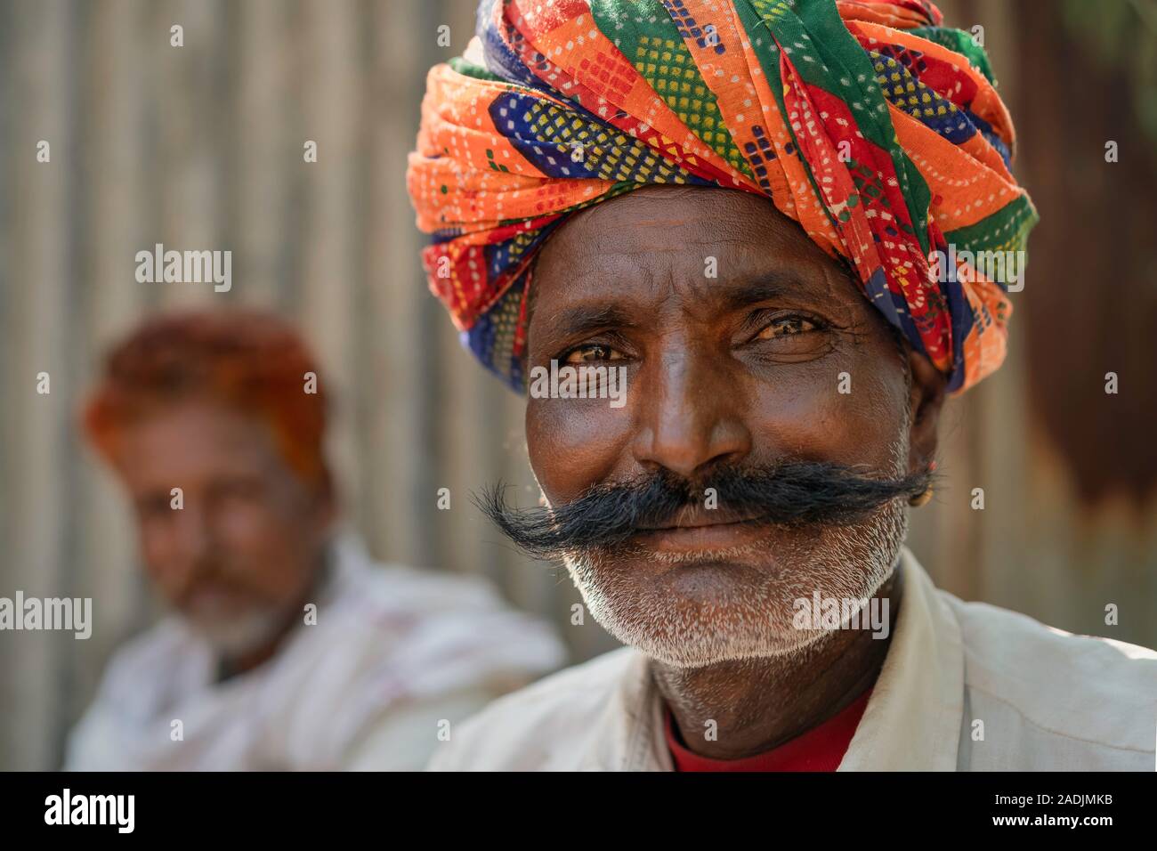 Traditional Rajput musician sporting moustache, stubble, and colorful turban on summer day on October 31, 2019 in Pushkar, Rajasthan, India. Stock Photo