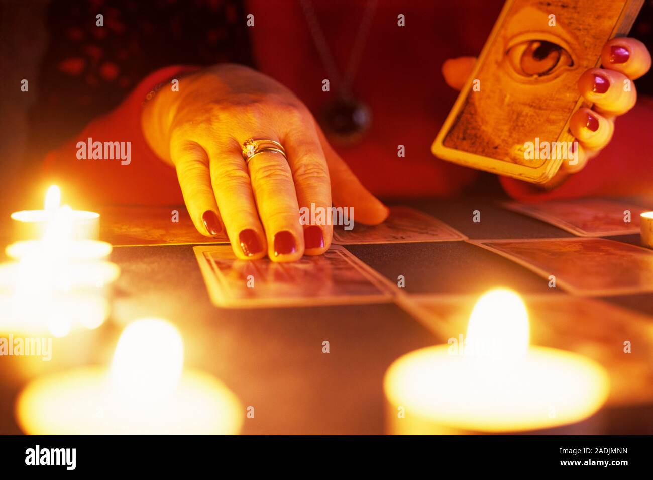 Fortune telling. Fortune teller lying out tarot cards to do a reading