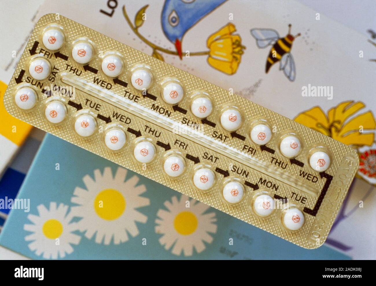 Oral contraceptive pills and their packaging; each pill is marked with ...